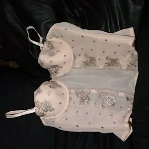 Corset with embroidery and lace.